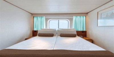 An old Holland America cruise ship is turning residential, letting travelers live at sea for $8,000 a month while it circumnavigates the globe